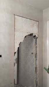 فتح باب في جدار خرساني في المهندسين